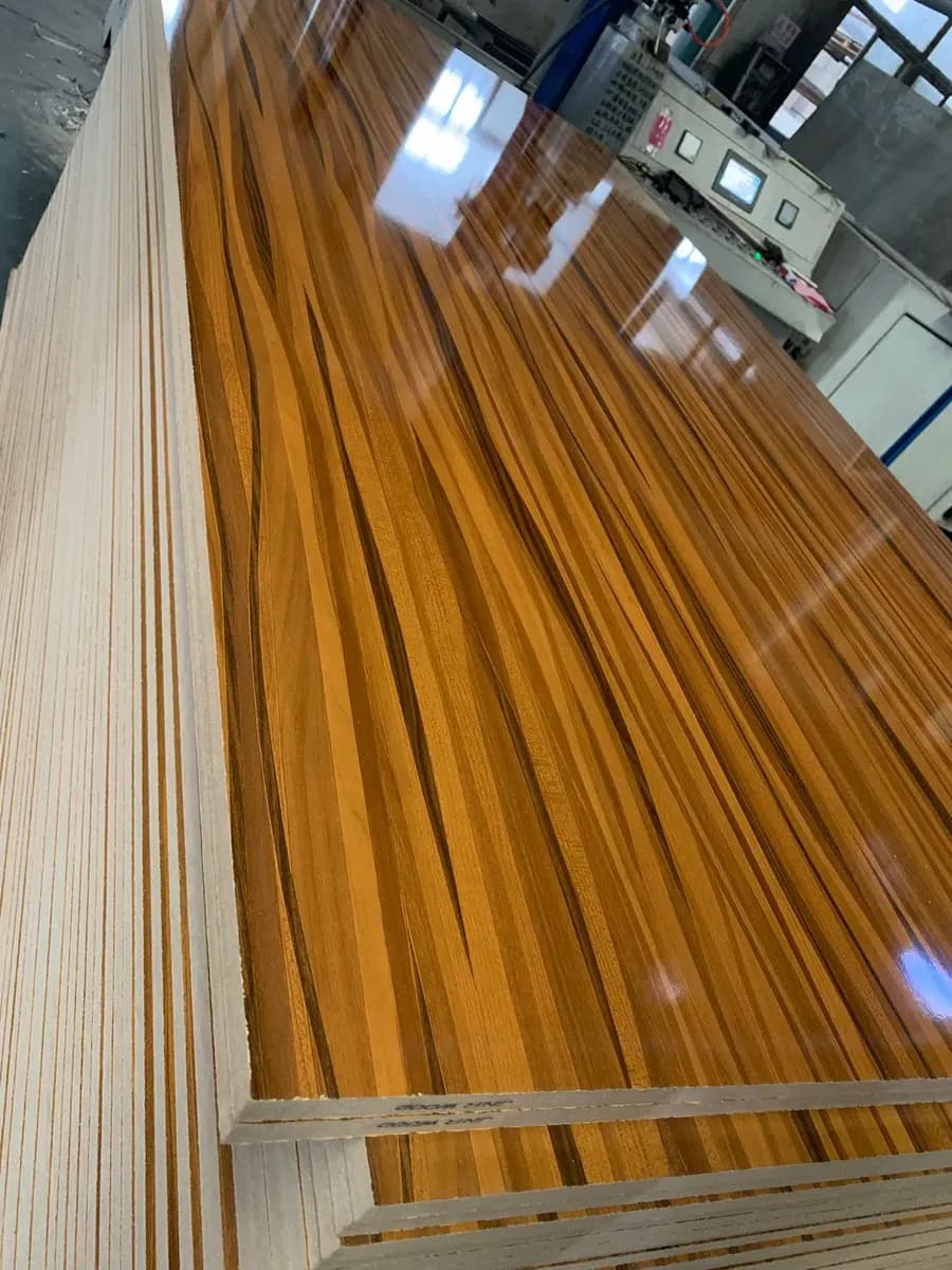 High gloss woodgrain Melamine MDF panels in production