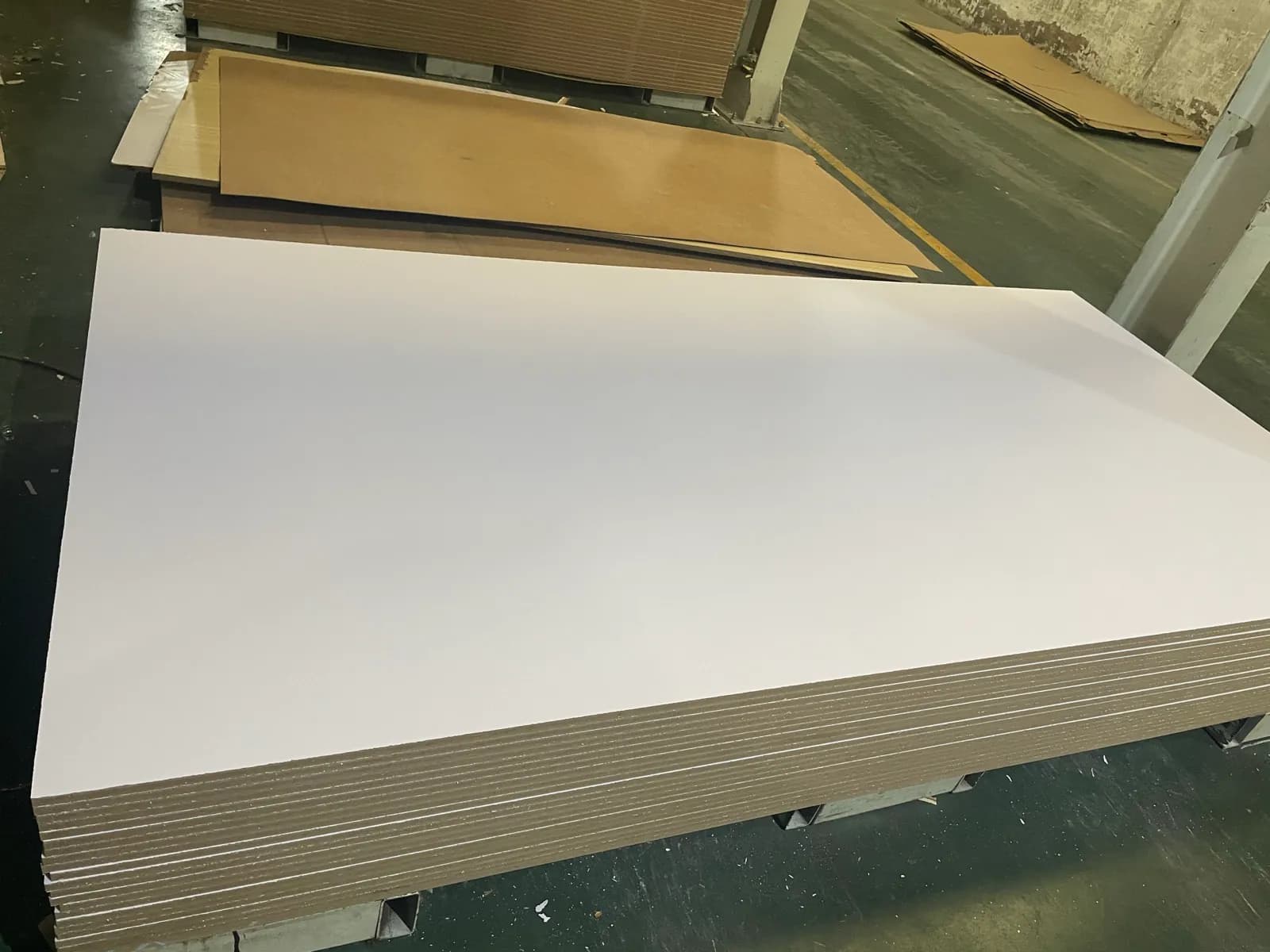 White Melamine MDF boards stacked after surface production